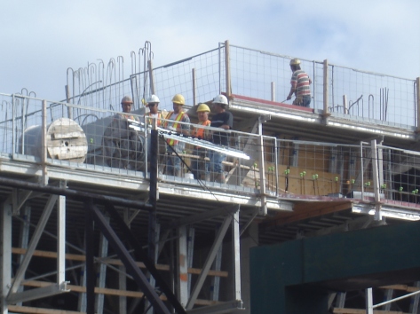 The construction crew watches the action